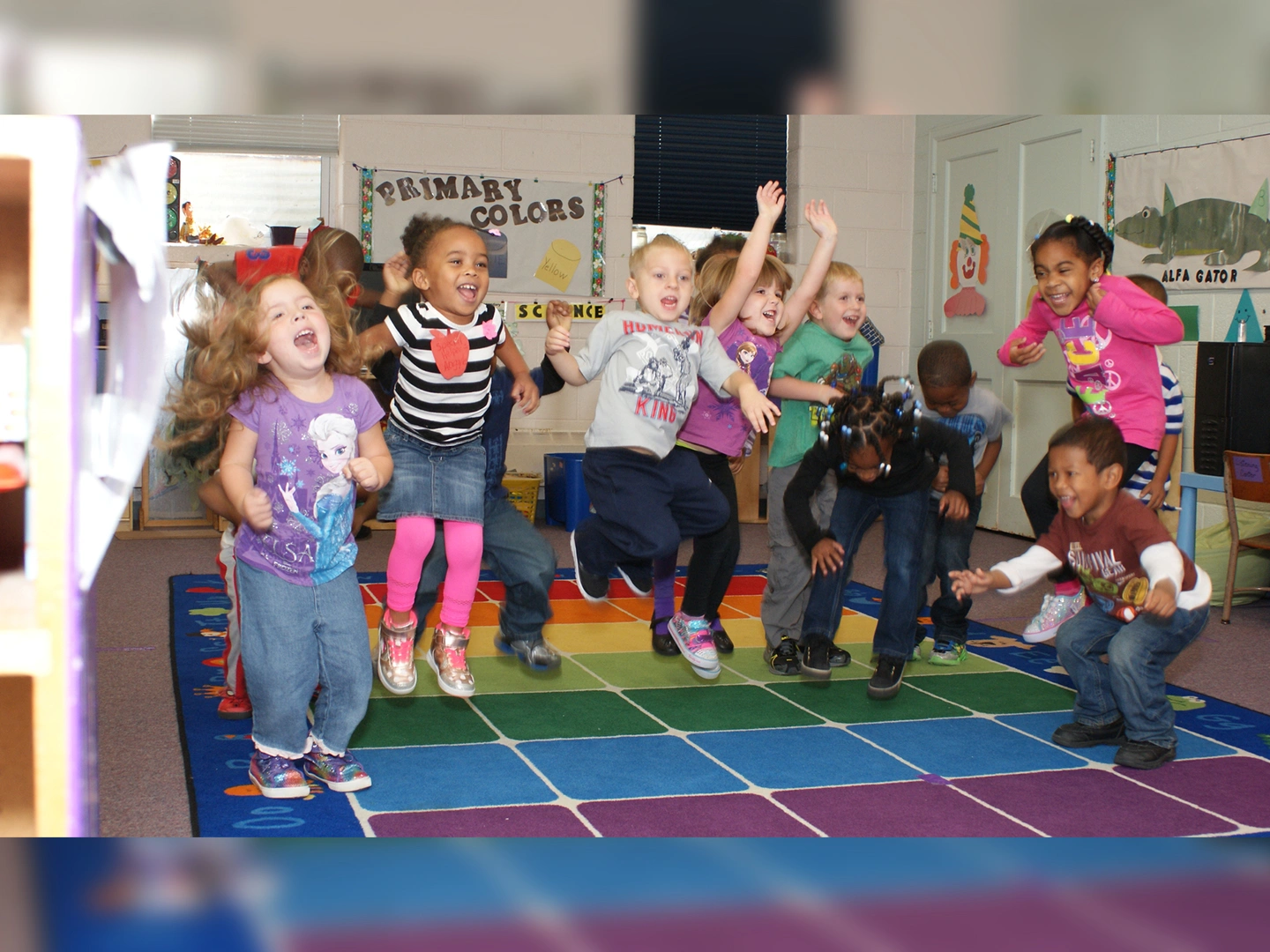 A group of children jumping in the air.