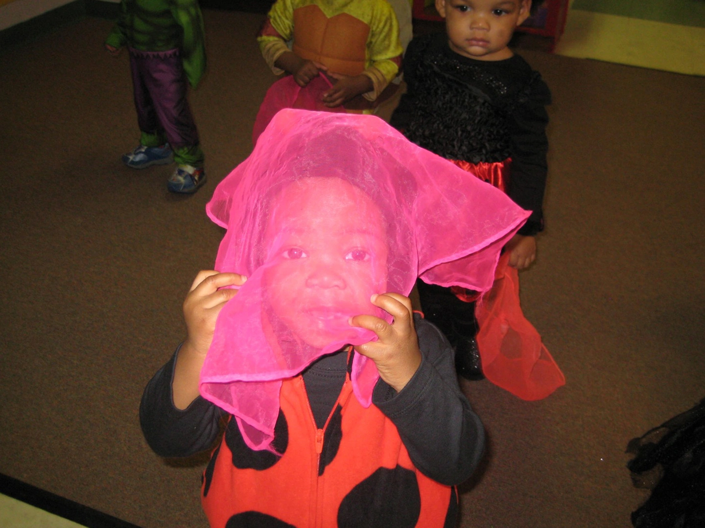 A group of kids in costumes at halloween.