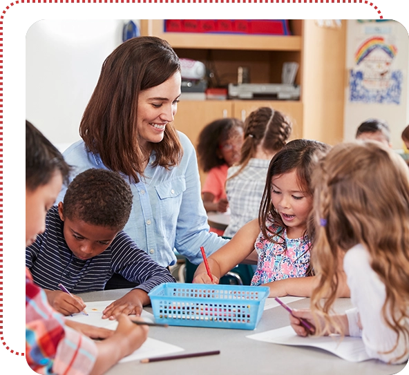 A woman is helping children with their homework.